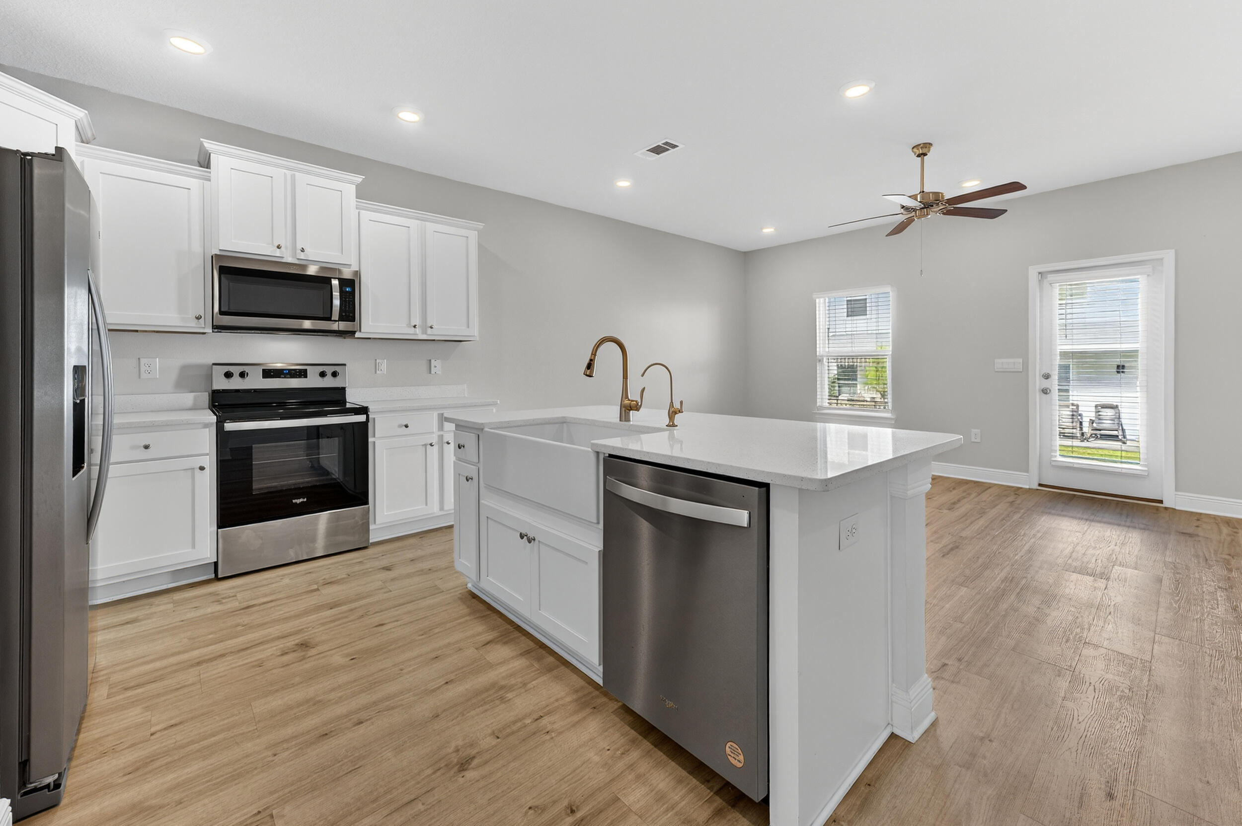 15 Redbird Loop Destin, FL 32541 - Photo 7 of 42 a kitchen with stainless steel appliances granite countertop a sink stove and refrigerator