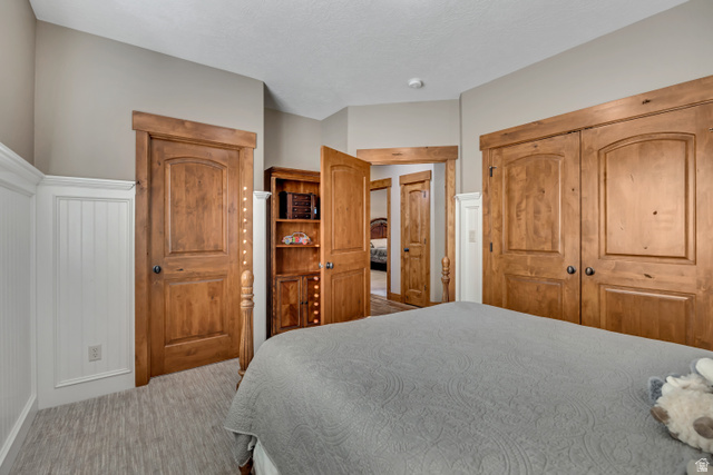 896 West 675 South Mapleton, UT 84664 - Photo 27 of 77 Carpeted bedroom featuring a closet and a decorative wall