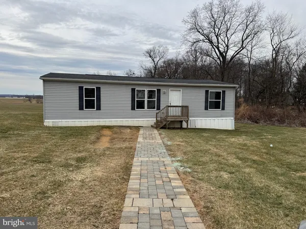 a front view of a house with yard