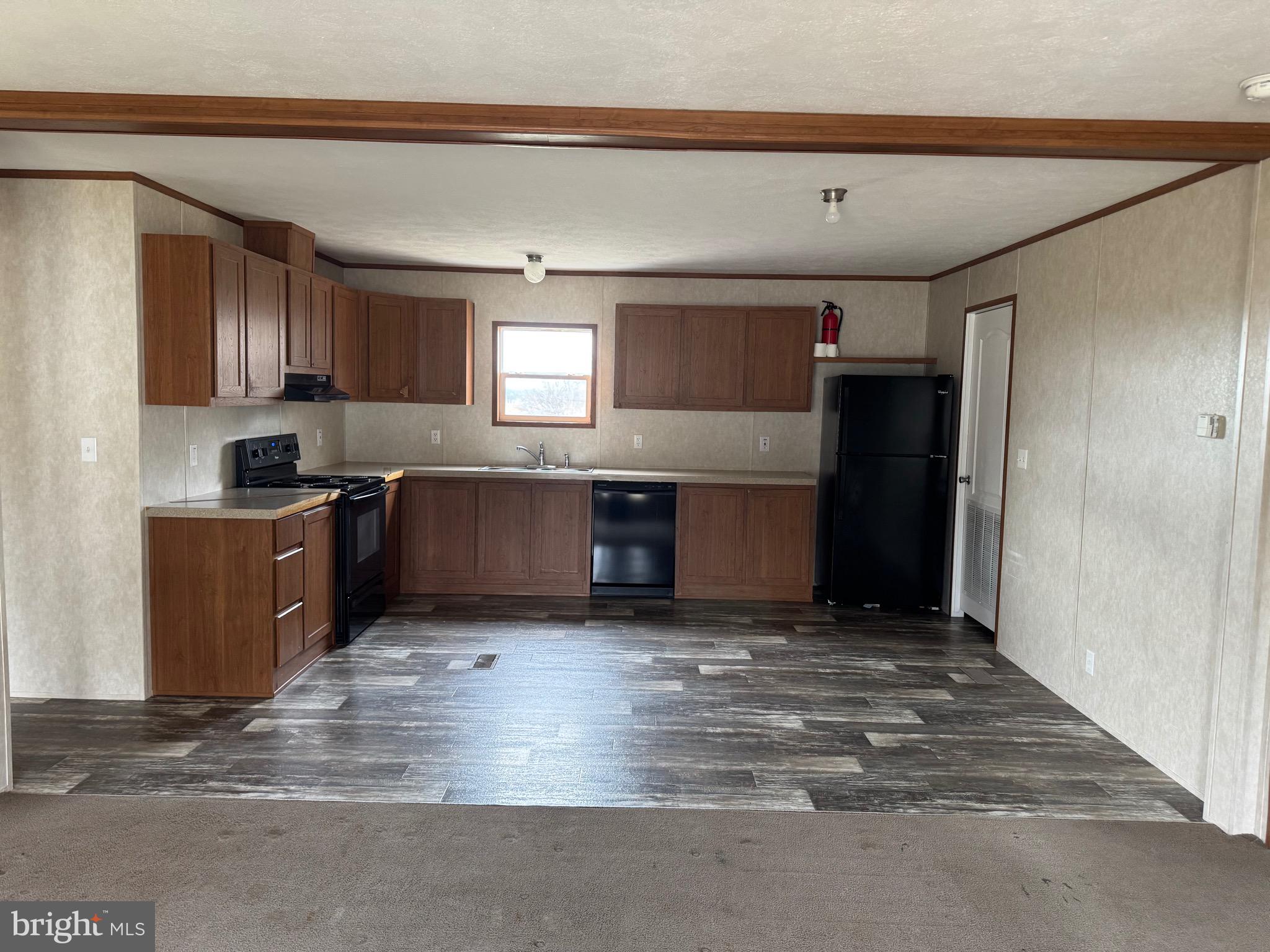 4254 Delta Road Airville, PA 17302 - Photo 2 of 9 a view of kitchen with kitchen island microwave and window