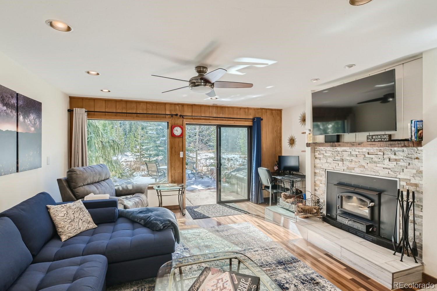 1904 Soda Ridge Road, Unit 1233 Keystone, CO 80435 - Photo 1 of 29 a living room with furniture a flat screen tv and a fireplace