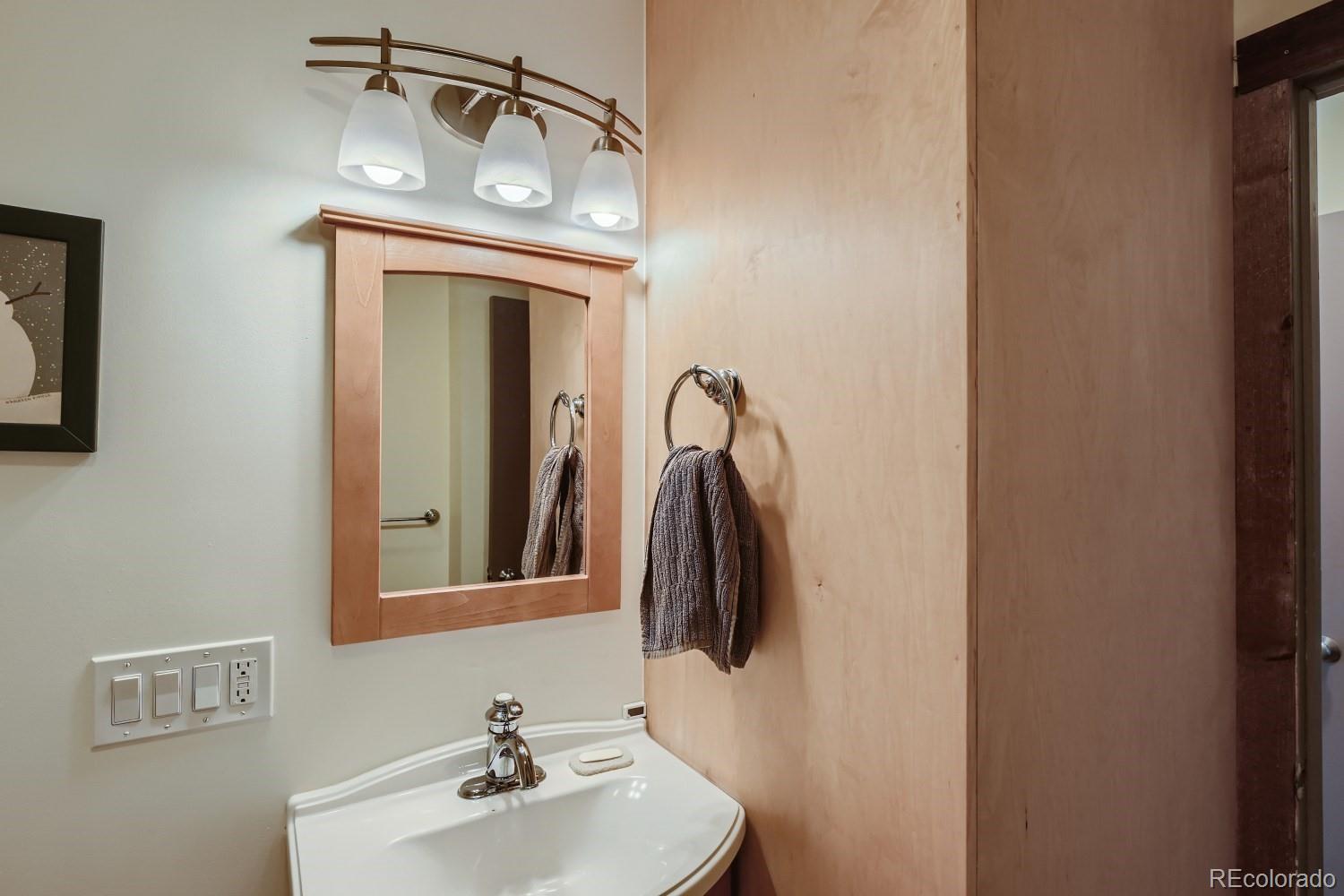 1904 Soda Ridge Road, Unit 1233 Keystone, CO 80435 - Photo 11 of 29 a bathroom with a sink and a mirror