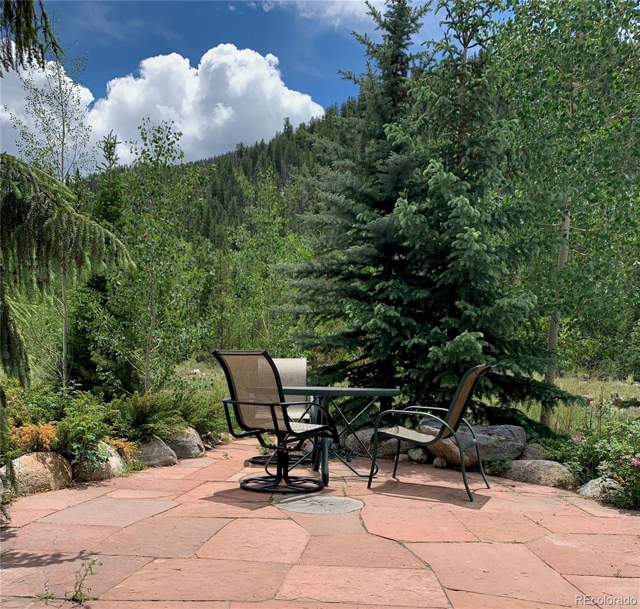 1904 Soda Ridge Road, Unit 1233 Keystone, CO 80435 - Photo 13 of 29 a view of a bench in a backyard