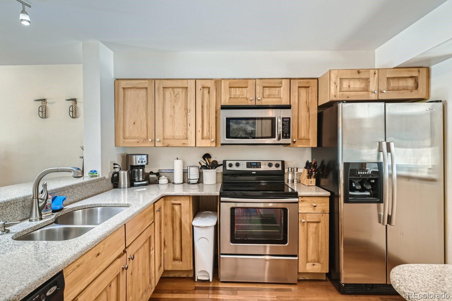 1904 Soda Ridge Road, Unit 1233 Keystone, CO 80435 - Photo 4 of 29 a kitchen with granite countertop a refrigerator stove and sink