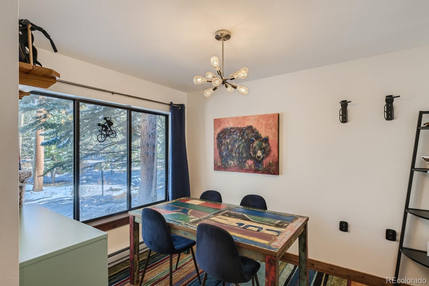 1904 Soda Ridge Road, Unit 1233 Keystone, CO 80435 - Photo 6 of 29 a view of a dining room with furniture window and outside view