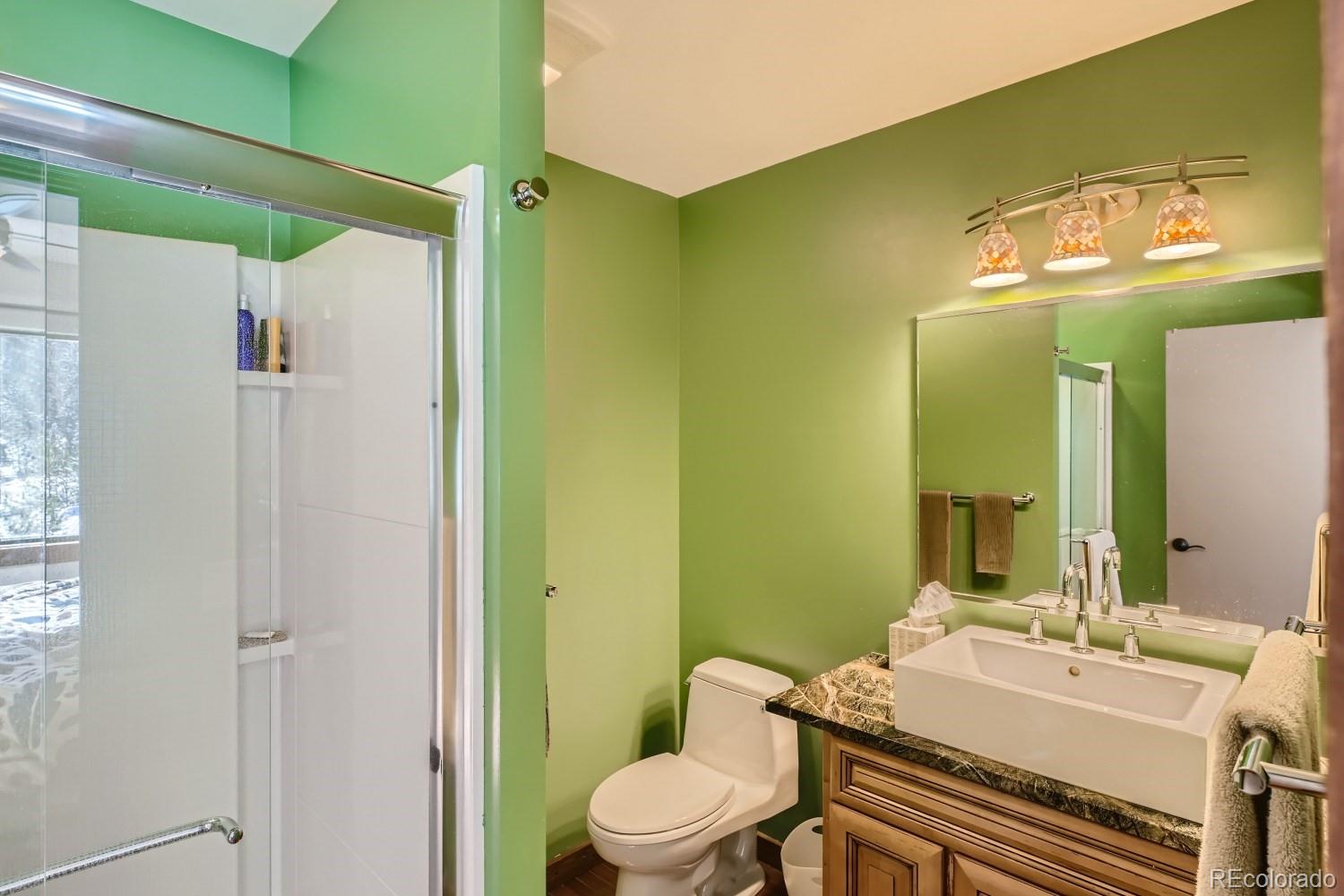 1904 Soda Ridge Road, Unit 1233 Keystone, CO 80435 - Photo 8 of 29 a bathroom with a sink and a mirror