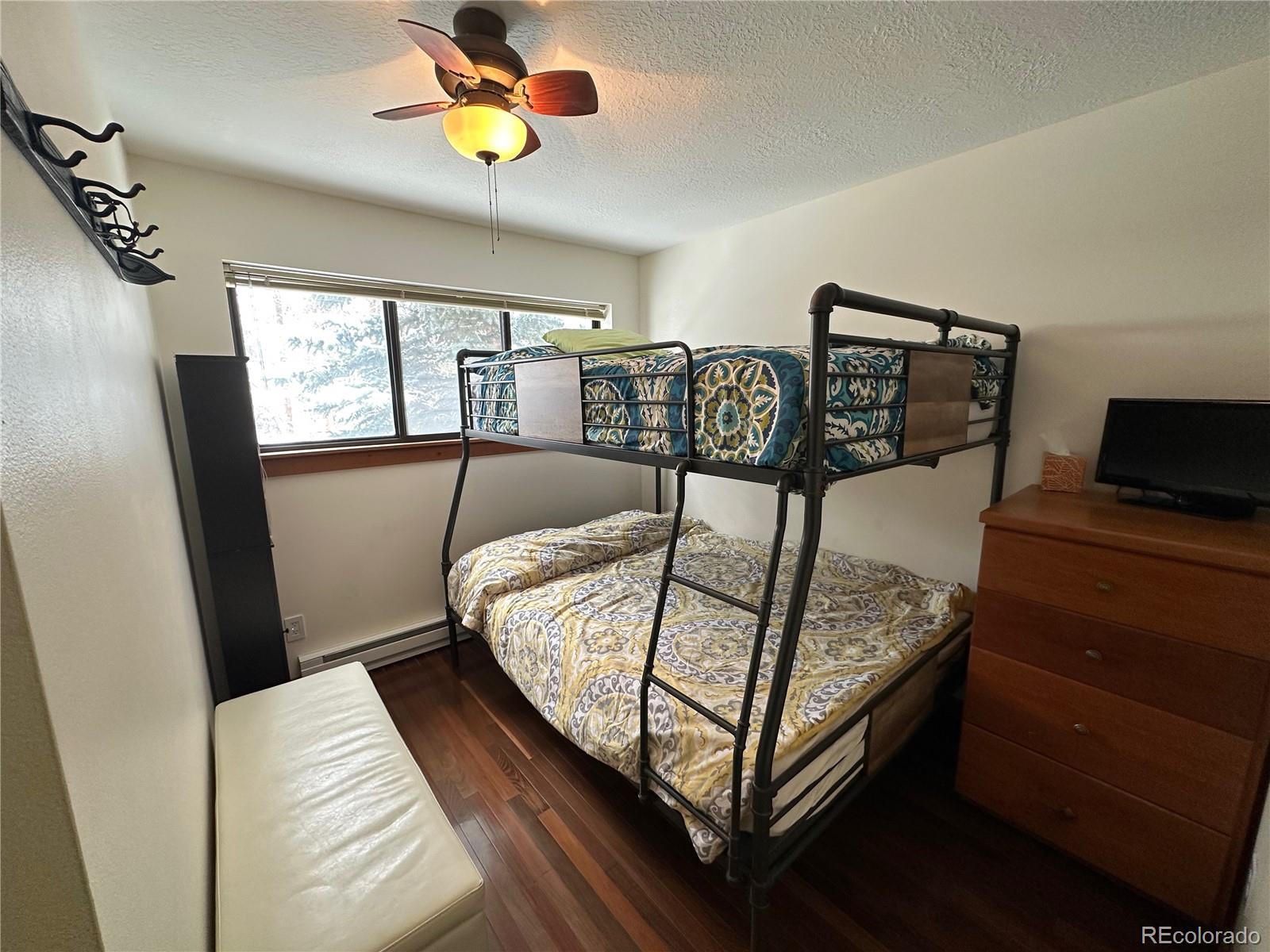 1904 Soda Ridge Road, Unit 1233 Keystone, CO 80435 - Photo 10 of 29 a bedroom with a bed and window