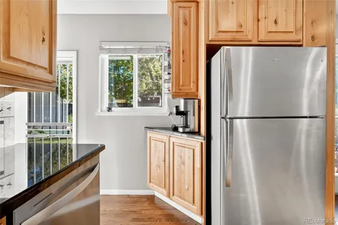 a living room with furniture and a book shelf