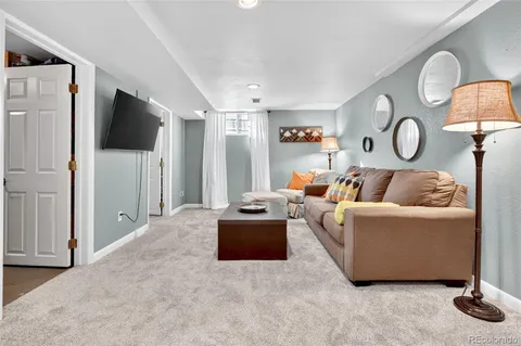 a view of a house with a yard porch and sitting area