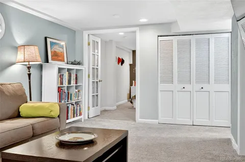 a view of backyard of house with green space