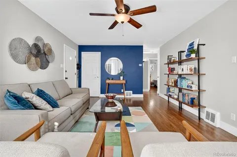 a kitchen with stainless steel appliances granite countertop a refrigerator a microwave and cabinets