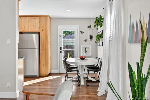 a kitchen with stainless steel appliances granite countertop a refrigerator and a stove