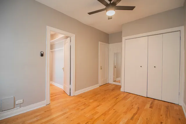 a view of a livingroom with a chandelier fan