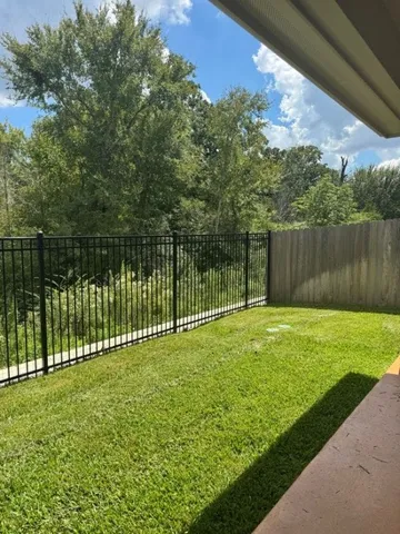 a view of a backyard with a lake view