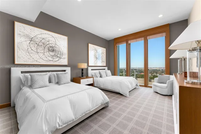 a bedroom with bed and large window