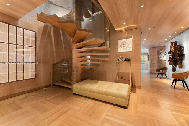 a bedroom with a bed and a chair