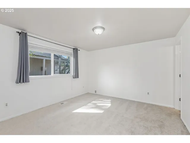 view of an empty room with a window