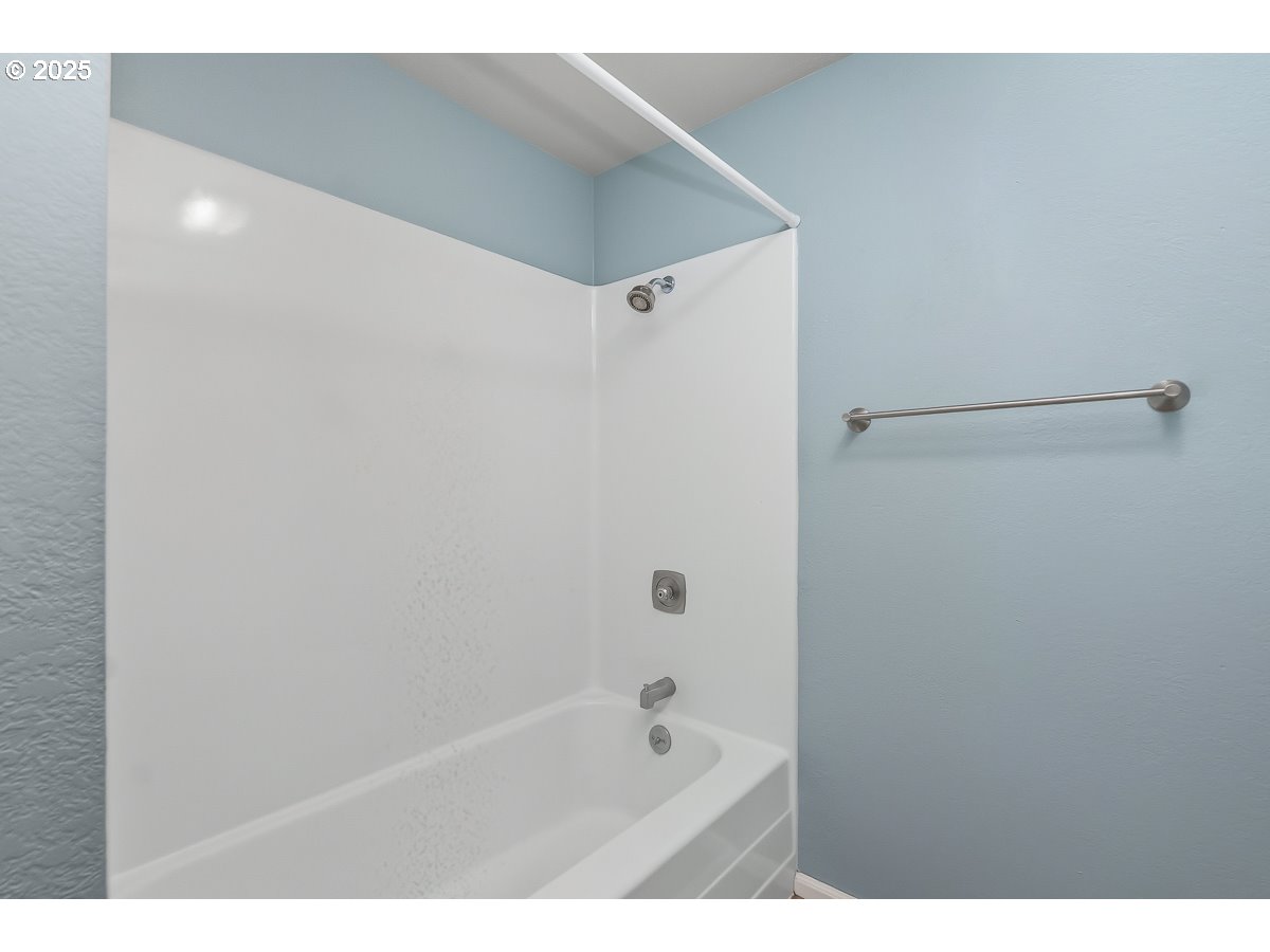 3247 Southeast Hathaway Drive Corvallis, OR 97333 - Photo 17 of 28 a bathroom with a bathtub and shower