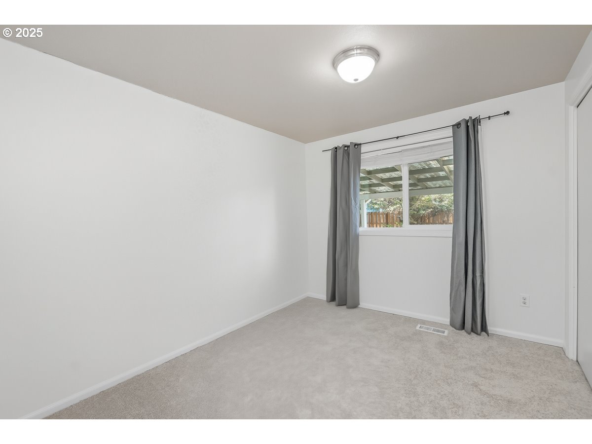 3247 Southeast Hathaway Drive Corvallis, OR 97333 - Photo 19 of 28 a view of an empty room with a window