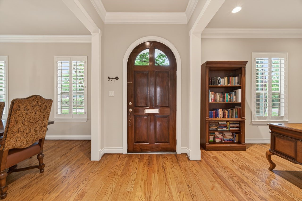 10932 Lasso Lane Houston, TX 77079 - Photo 4 of 38 a view of an empty room with window and wooden floor
