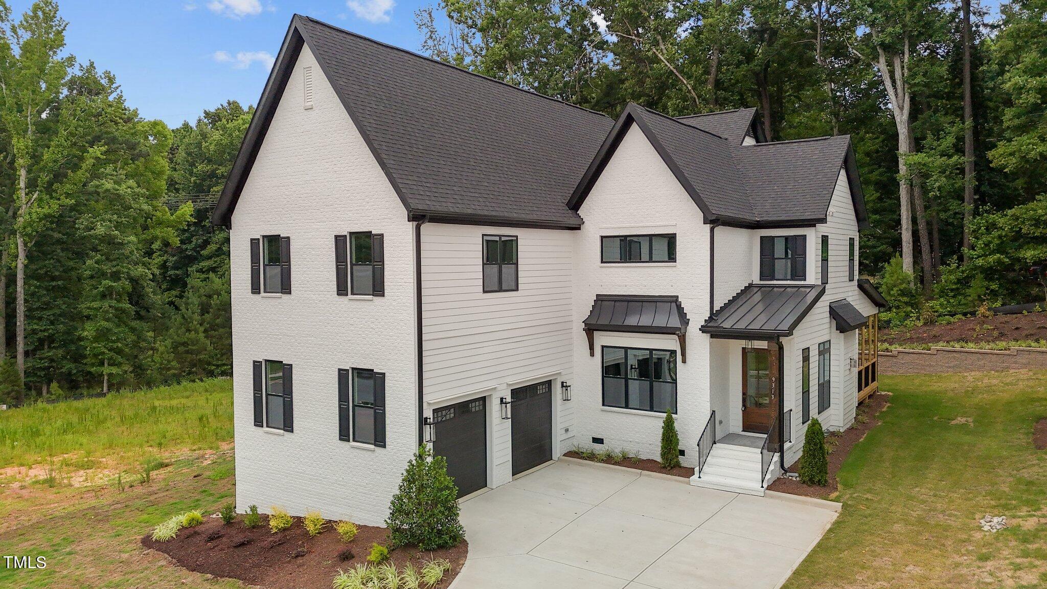 9313 Field Maple Court Raleigh, NC 27613 - Photo 1 of 53 a view of house with garden