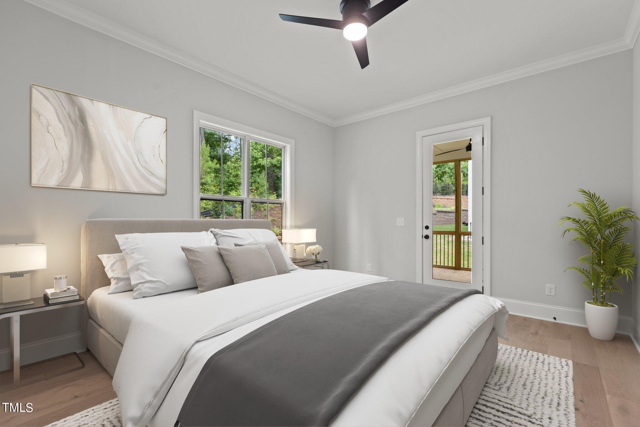 9313 Field Maple Court Raleigh, NC 27613 - Photo 21 of 53 a bedroom with a large bed and a window