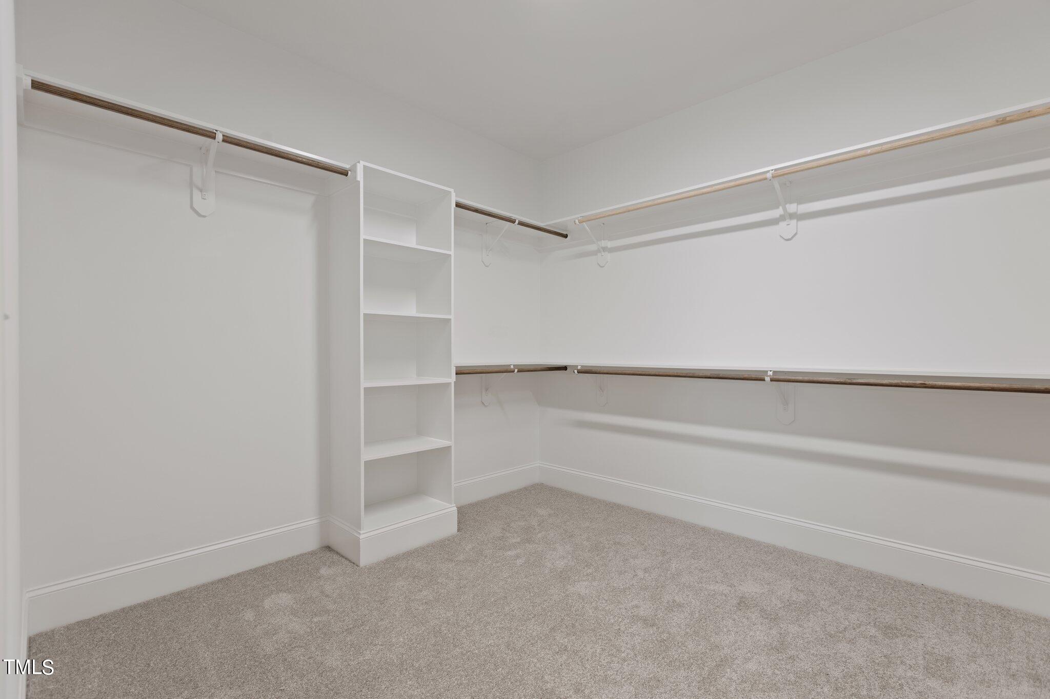 9313 Field Maple Court Raleigh, NC 27613 - Photo 35 of 53 a view of an empty walk in closet