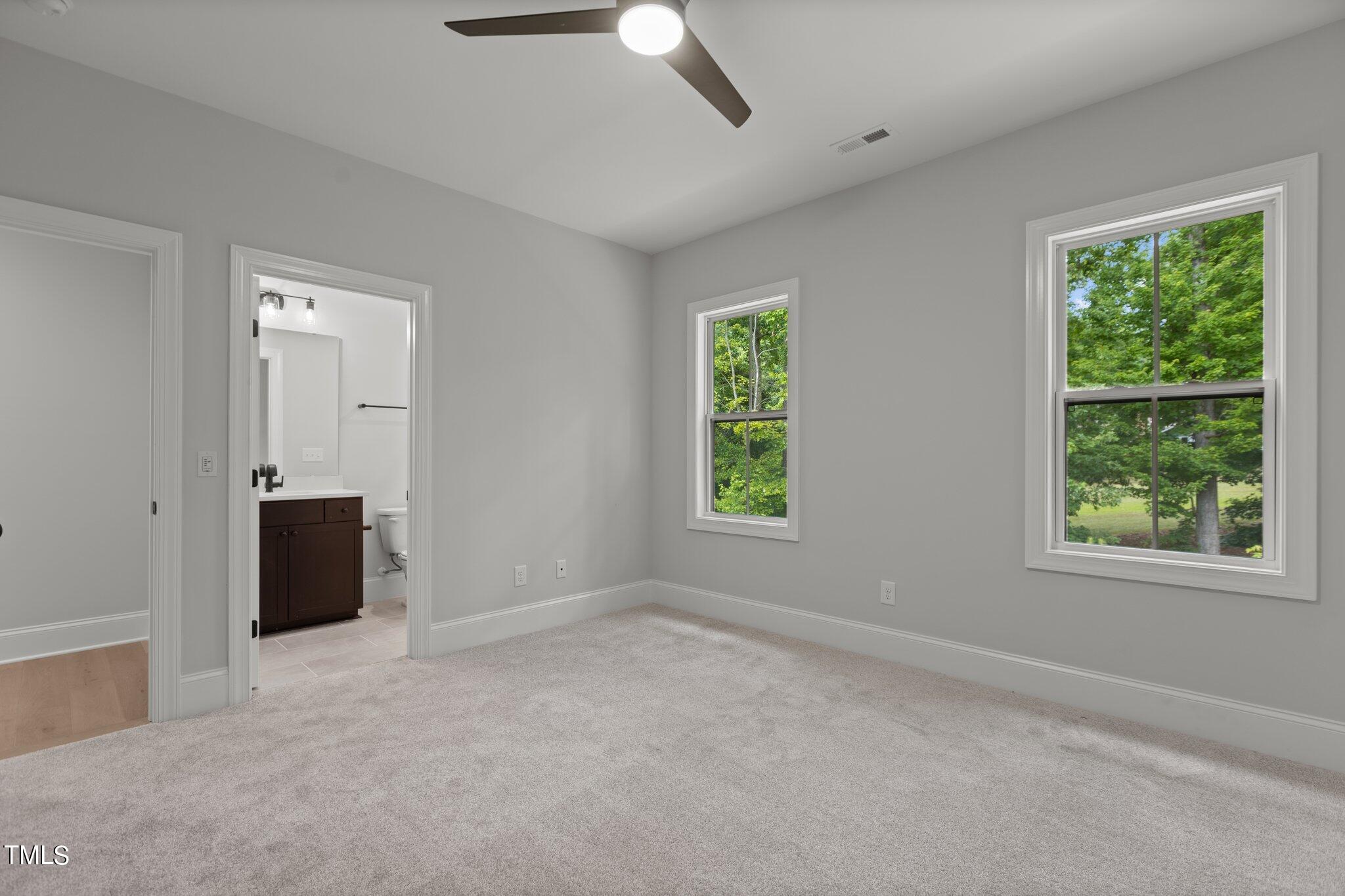 9313 Field Maple Court Raleigh, NC 27613 - Photo 46 of 53 an empty room with windows and closet