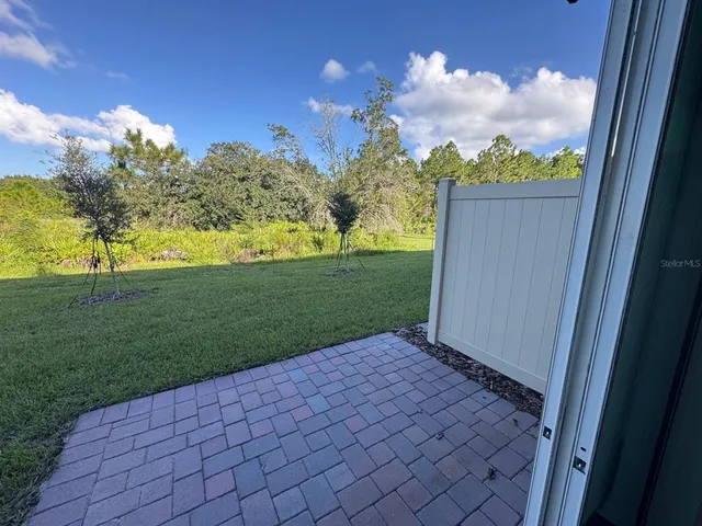 a view of a backyard with garden