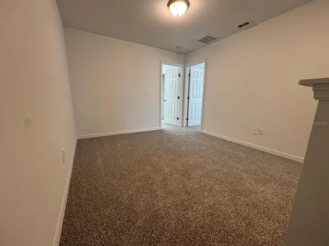 en empty room with windows