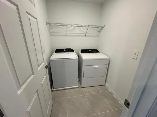 a utility room with dryer and washer