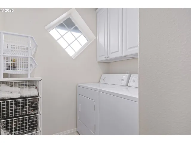 a bed room with a bed and a chair