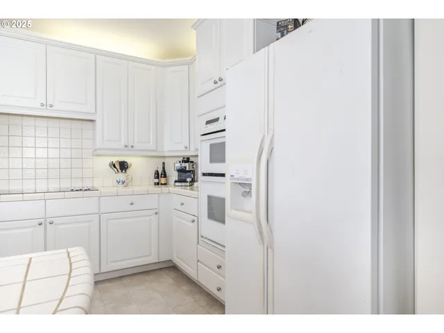 a view of a dining room with furniture and window