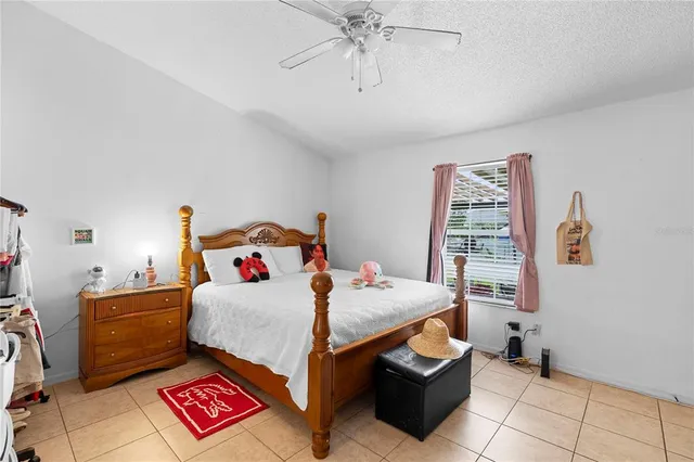 a bedroom with furniture and a chandelier