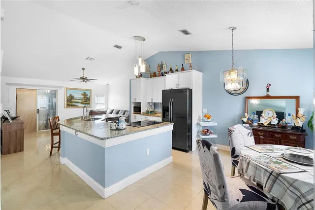 a kitchen with a sink stove and refrigerator
