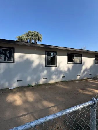 a view of wooden floor and a window