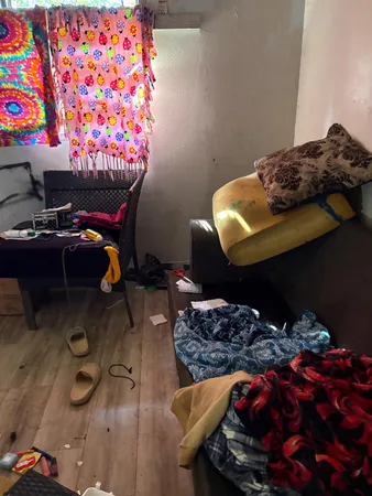 a white bath tub sitting next to a white wall