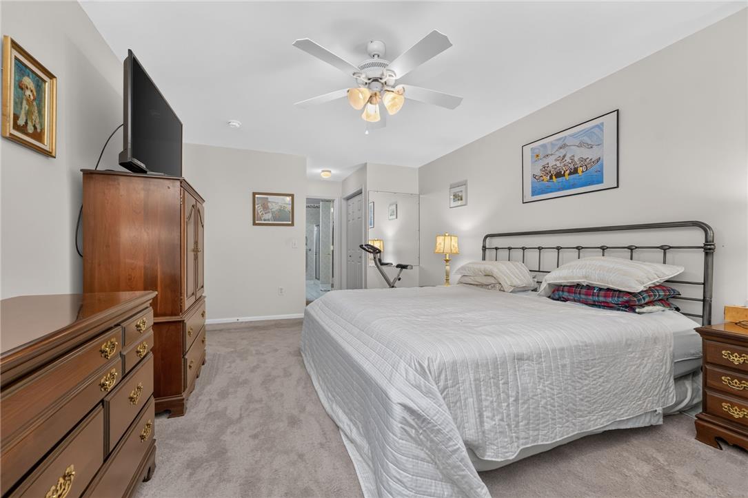 198 Park Ridge Drive Easton, PA 18040 - Photo 12 of 28 A restful bedroom offers a cozy carpeted floor and an overhead ceiling fan for comfort.