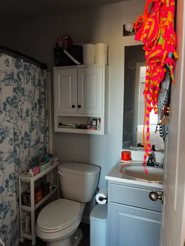 a bathroom with a toilet and a sink