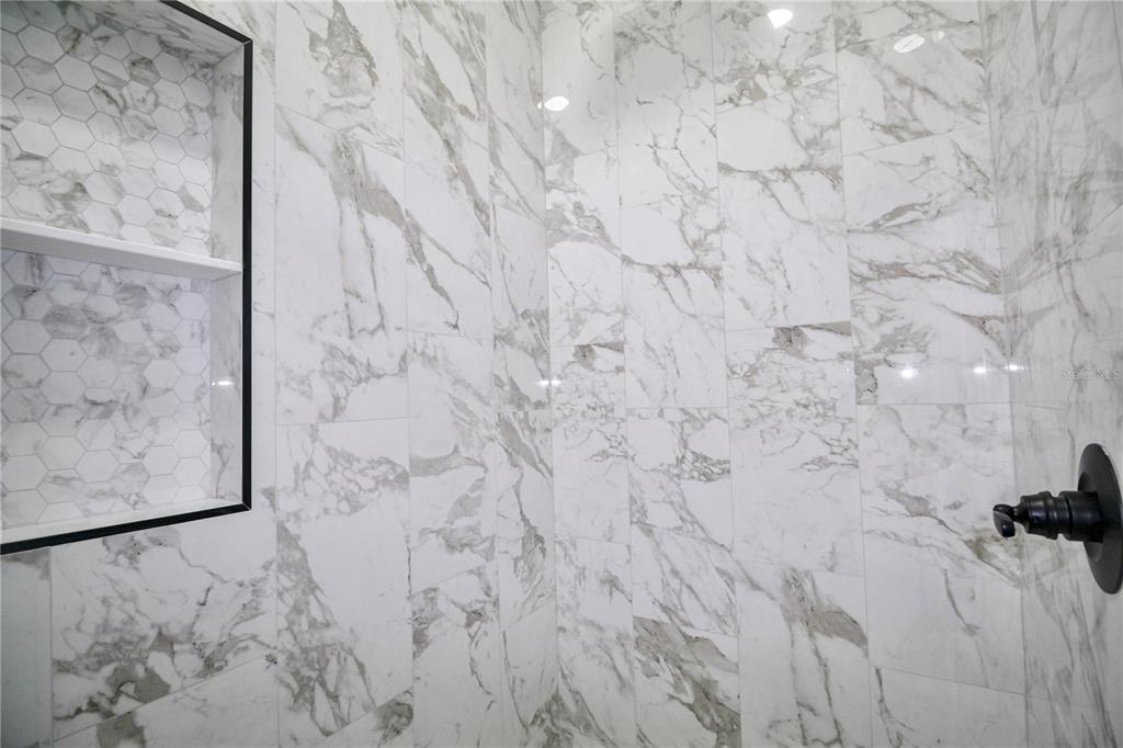 7335 Domenico Street Sebring, FL 33872 - Photo 22 of 38 a bathroom with a shower