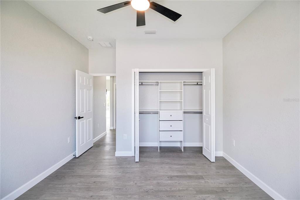 7335 Domenico Street Sebring, FL 33872 - Photo 28 of 38 an empty room with closet and a ceiling fan