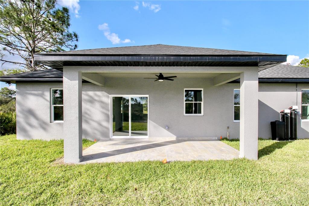 7335 Domenico Street Sebring, FL 33872 - Photo 35 of 38 a front view of a house with a yard