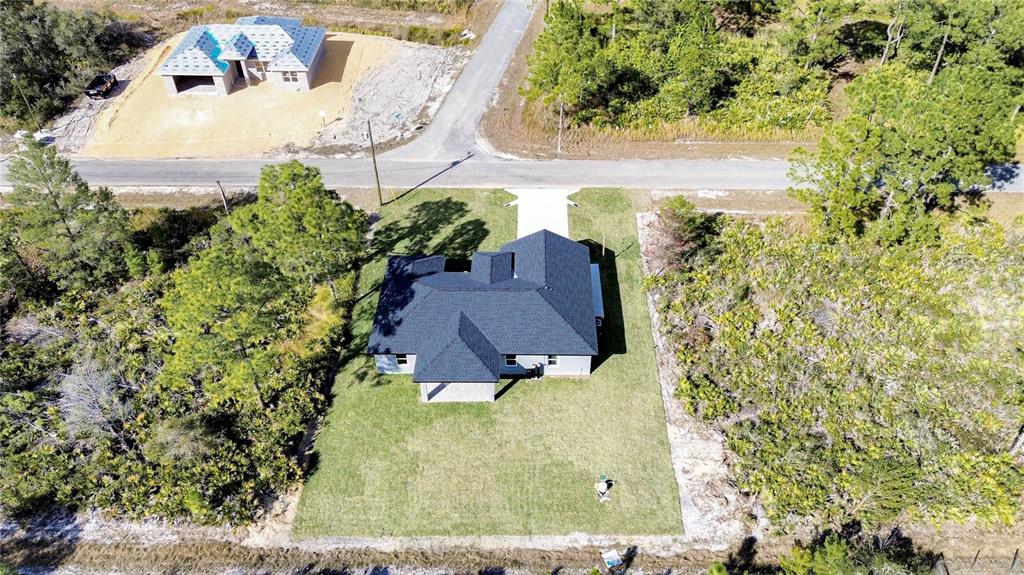 7335 Domenico Street Sebring, FL 33872 - Photo 37 of 38 an aerial view of a house with yard swimming pool and outdoor seating