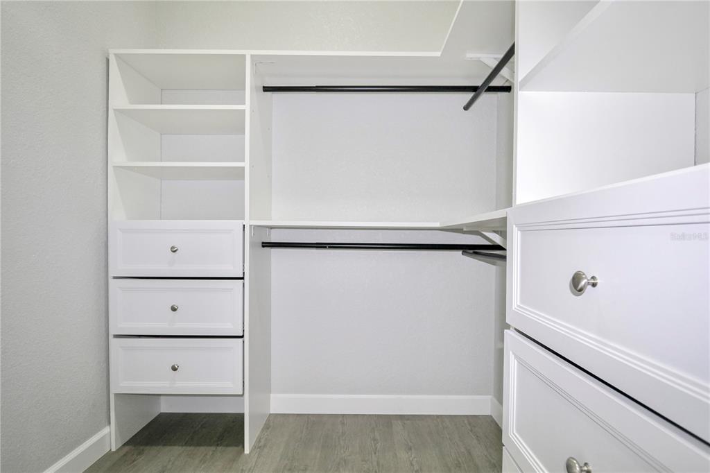 7335 Domenico Street Sebring, FL 33872 - Photo 4 of 38 a view of walk in closet with empty racks