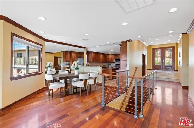 a view of a dining room with furniture window and wooden floor