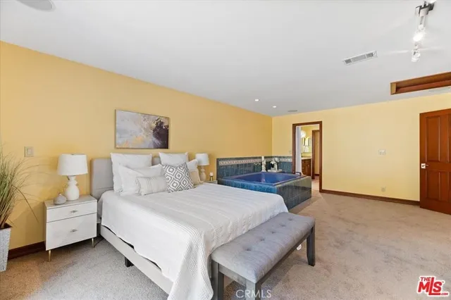 a bed room with a bed and a couch