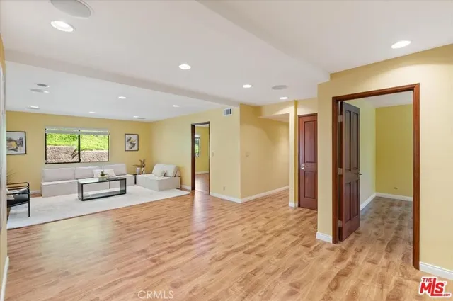 a view of a livingroom with furniture and wooden floor
