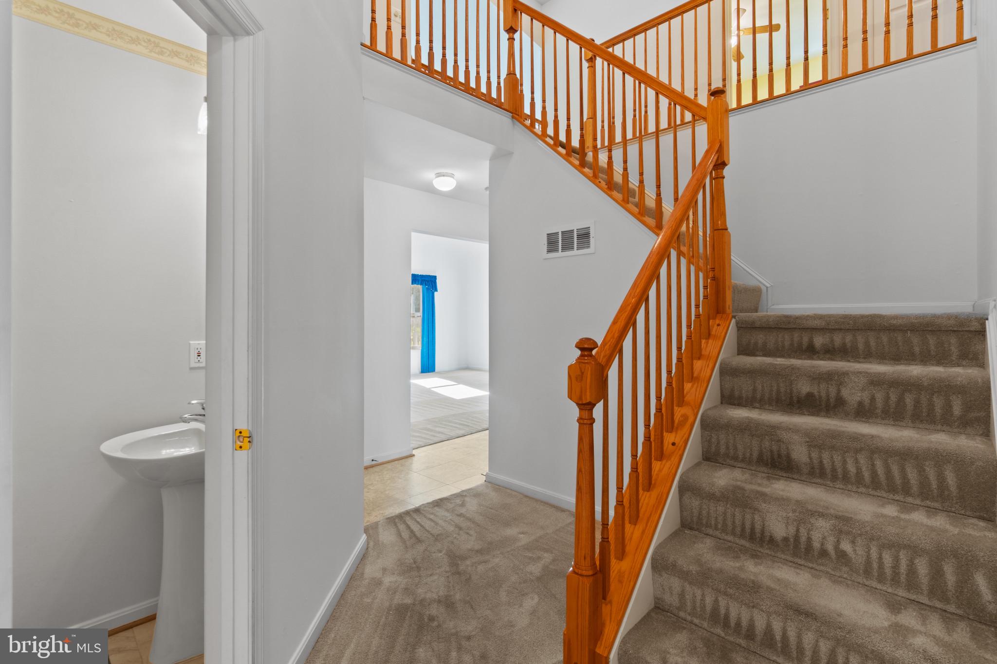 2008 Windys Run Road Catonsville, MD 21228 - Photo 23 of 53 Foyer to stairs and half bath