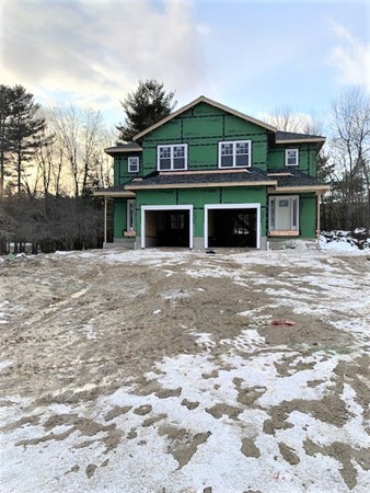 15 Shaker Road, Unit B Ayer, MA 01432 - Photo 3 of 7 a front view of a house with a yard