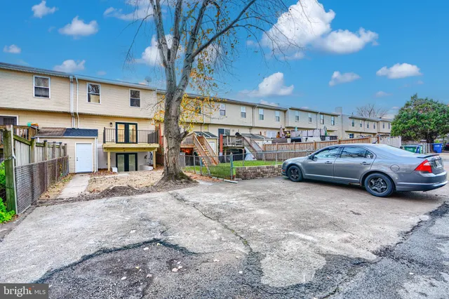 a view of a cars park in front of house